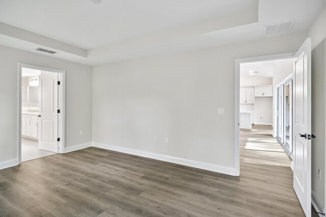 spare room featuring hardwood / wood-style floors