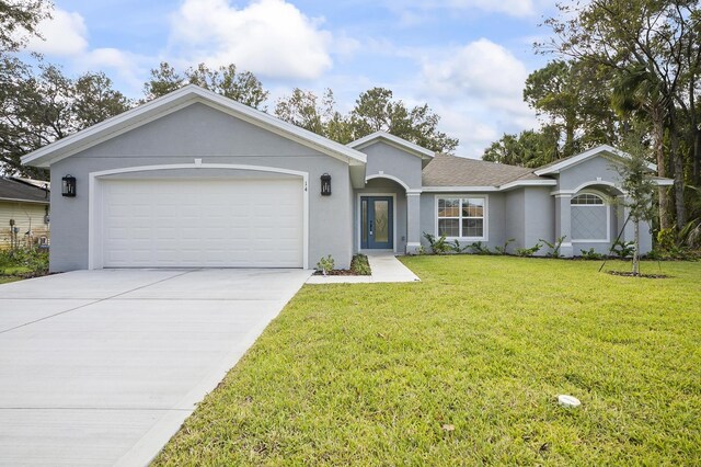 ranch-style house with a garage and a front yard