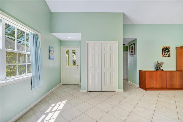 tiled bedroom featuring a closet