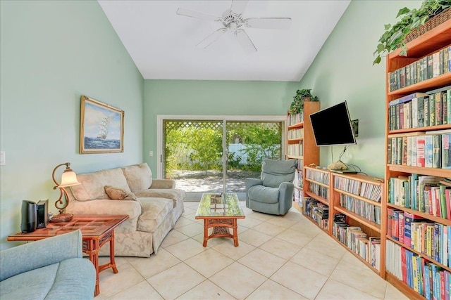 tiled living room featuring ceiling fan and vaulted ceiling