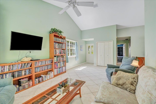 tiled living room featuring high vaulted ceiling and ceiling fan