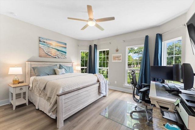 633 W Pope Rd, Saint Augustine, FL 32080 - bedroom featuring a desk, light wood-style flooring, and a ceiling fan
