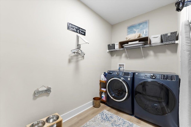 633 W Pope Rd, Saint Augustine, FL 32080 - washroom with washer and dryer and light wood-style floors