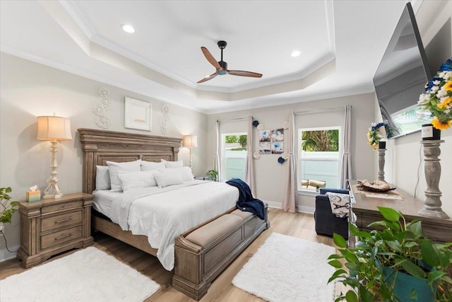 633 W Pope Rd, Saint Augustine, FL 32080 - bedroom featuring a tray ceiling, light wood finished floors, crown molding, recessed lighting, and a ceiling fan