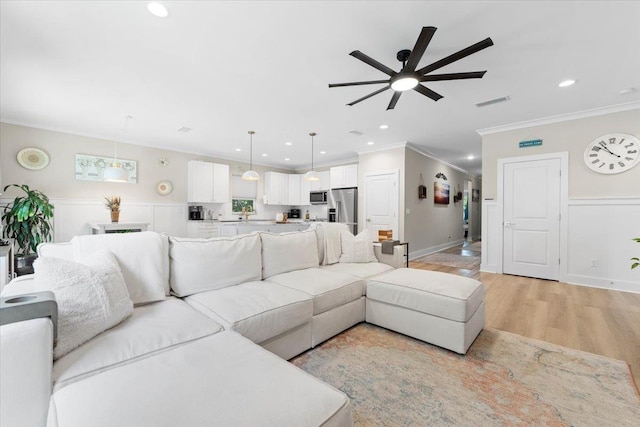 633 W Pope Rd, Saint Augustine, FL 32080 - living area featuring a ceiling fan, ornamental molding, light wood-style flooring, and recessed lighting