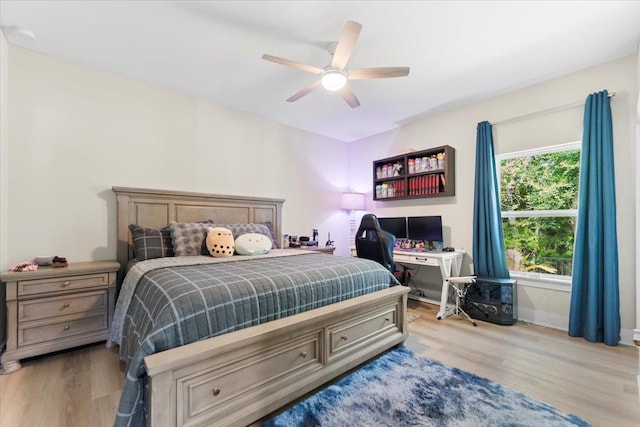 633 W Pope Rd, Saint Augustine, FL 32080 - bedroom featuring light wood finished floors, a desk, and a ceiling fan