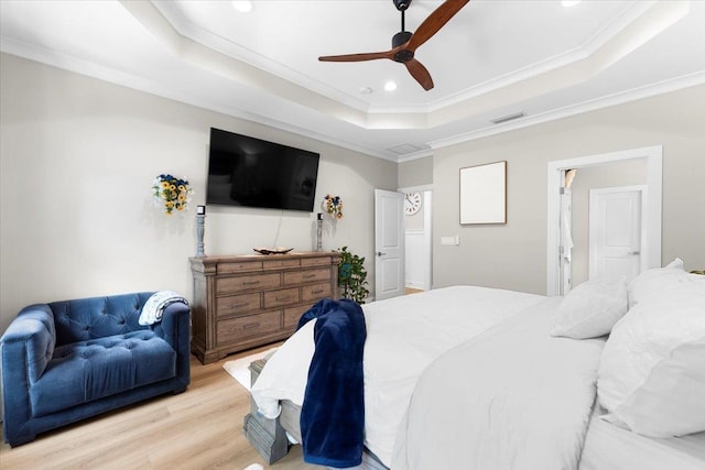 633 W Pope Rd, Saint Augustine, FL 32080 - bedroom with a tray ceiling, ornamental molding, light wood-style flooring, recessed lighting, and ceiling fan