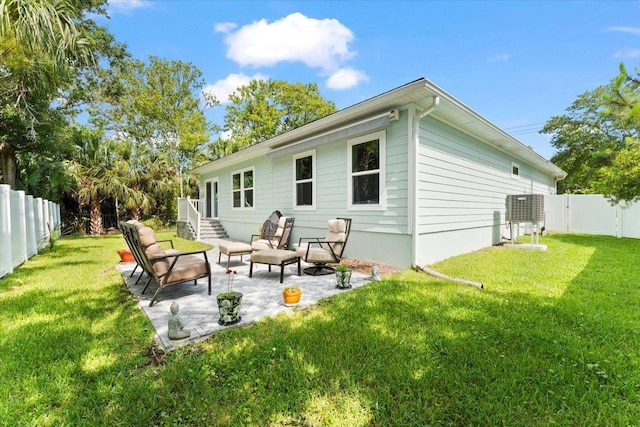 633 W Pope Rd, Saint Augustine, FL 32080 - rear view of house featuring a fenced backyard and a patio area