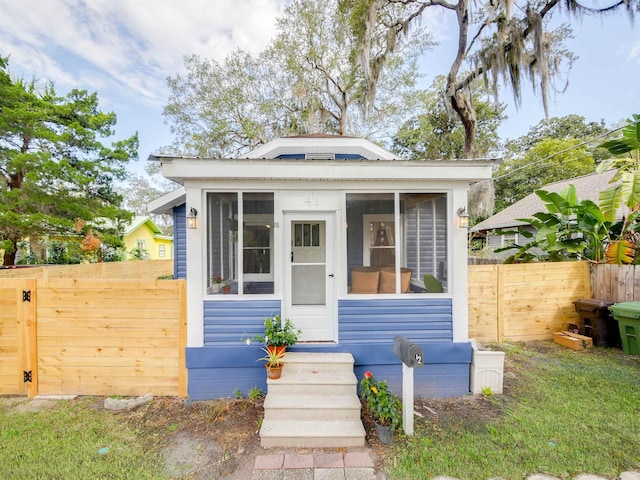 bungalow-style home featuring a sunroom