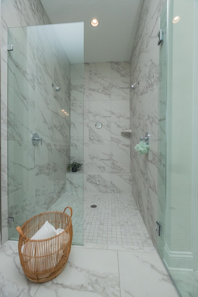 bathroom with a shower with shower door