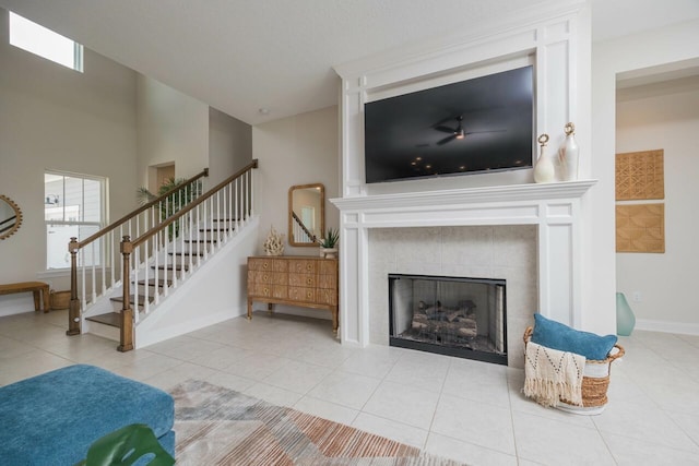 tiled living room with a tile fireplace