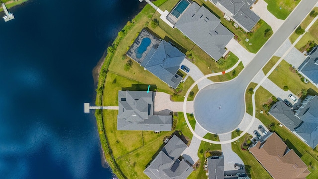 birds eye view of property with a water view