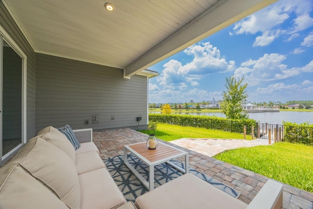 view of patio featuring outdoor lounge area and a water view