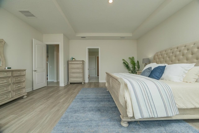 bedroom with light wood-type flooring