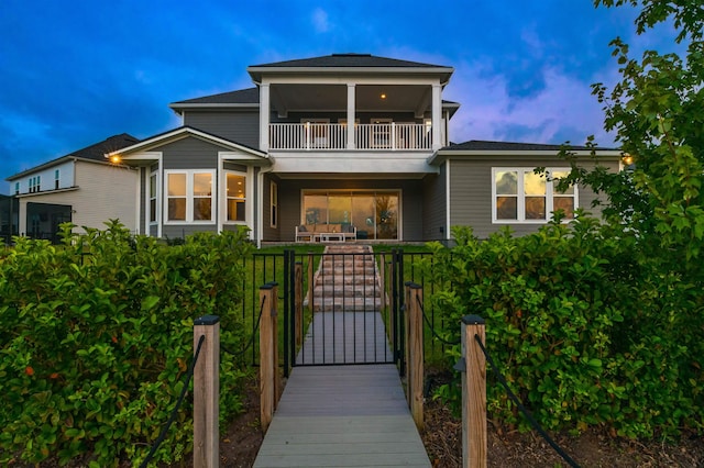 view of front of home with a balcony