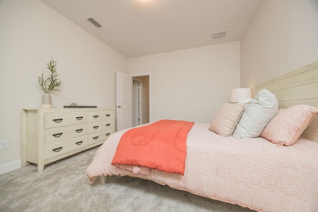 bedroom featuring light carpet