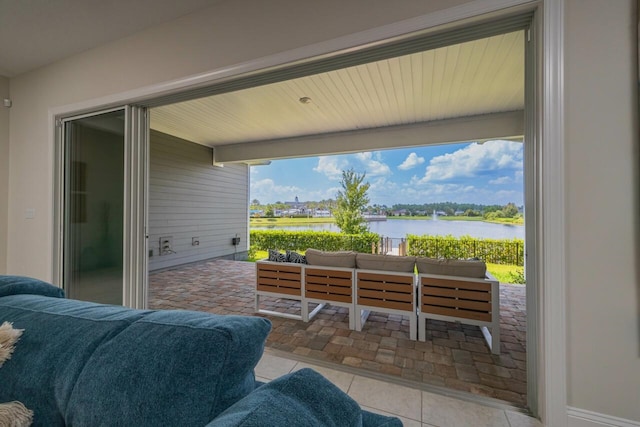 view of patio / terrace with outdoor lounge area and a water view