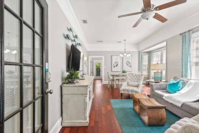 54 Grove Ave, Saint Augustine, FL 32084 - living room featuring dark wood-style flooring, baseboards, ceiling fan, crown molding, and a chandelier