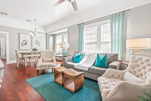 54 Grove Ave, Saint Augustine, FL 32084 - living room featuring dark wood finished floors, ceiling fan, a chandelier, and baseboards