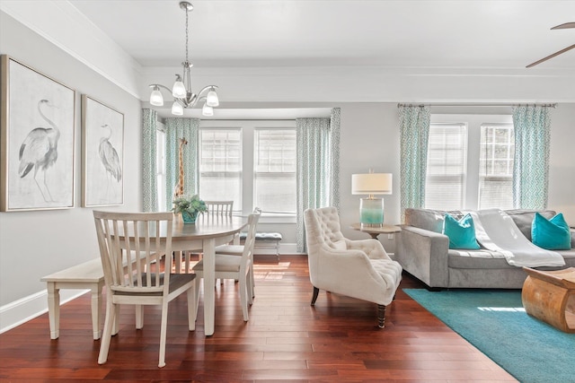 54 Grove Ave, Saint Augustine, FL 32084 - dining area featuring wood-type flooring, a chandelier, and baseboards