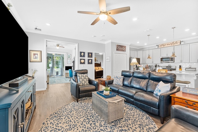 313 Aventurine Ave, Saint Augustine, FL 32086 - living room with a ceiling fan, light wood-style flooring, ornamental molding, and recessed lighting