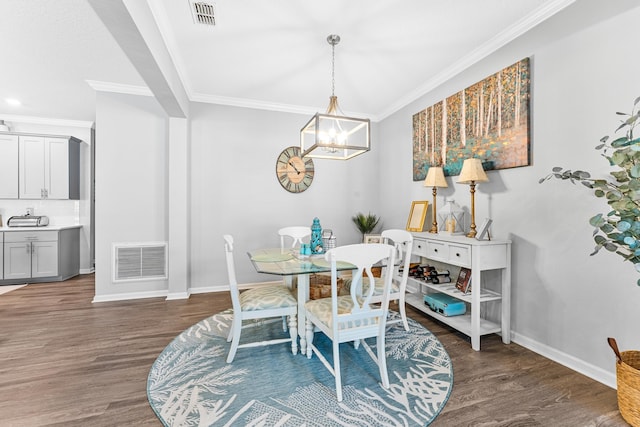 313 Aventurine Ave, Saint Augustine, FL 32086 - dining space with a chandelier, wood finished floors, and ornamental molding