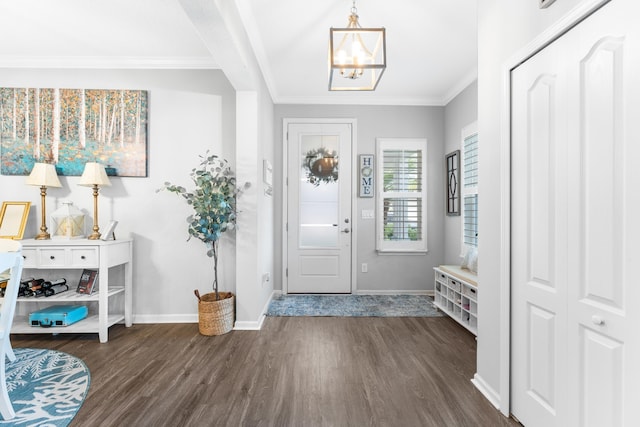 313 Aventurine Ave, Saint Augustine, FL 32086 - entryway with dark wood-style floors, a chandelier, and crown molding