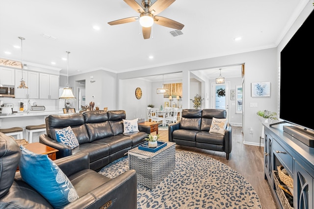 313 Aventurine Ave, Saint Augustine, FL 32086 - living room featuring wood finished floors, a ceiling fan, recessed lighting, and crown molding