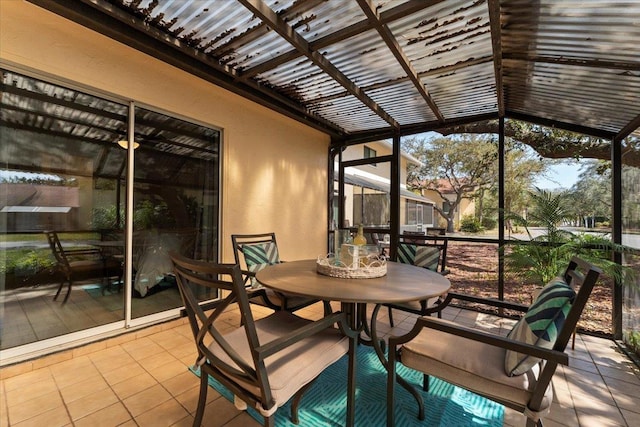 unfurnished sunroom with vaulted ceiling