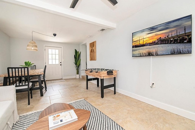 living room featuring beam ceiling