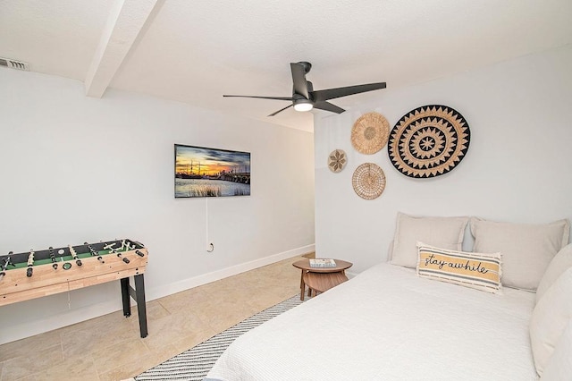 bedroom featuring ceiling fan and beamed ceiling