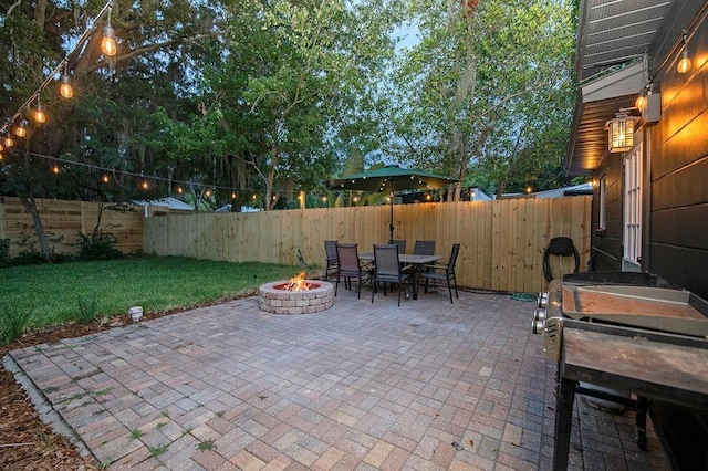 view of patio with an outdoor fire pit