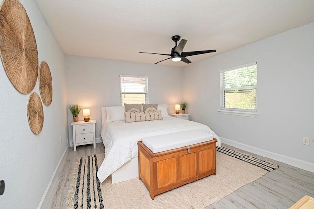 bedroom featuring light hardwood / wood-style floors and ceiling fan