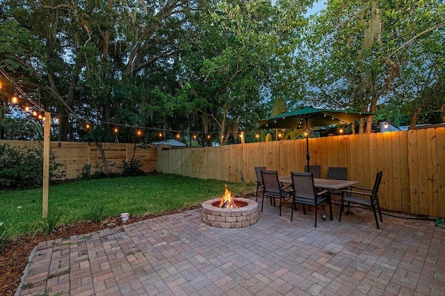 view of patio / terrace featuring a fire pit