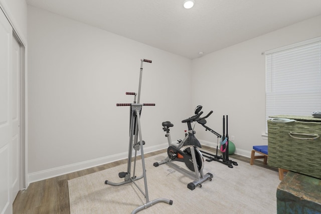 exercise area with hardwood / wood-style flooring