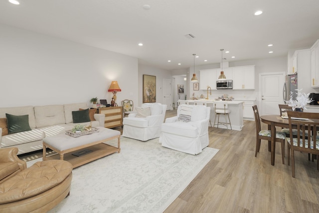 living room featuring light wood-type flooring