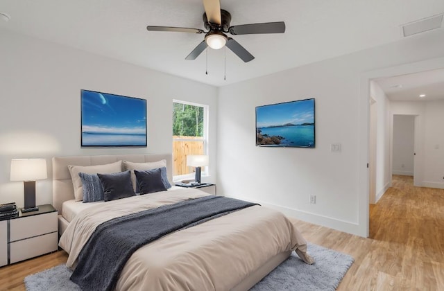 bedroom featuring ceiling fan and light wood-type flooring