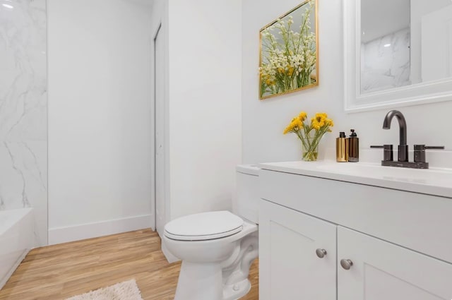 full bathroom with shower / bath combination, vanity, toilet, and wood-type flooring