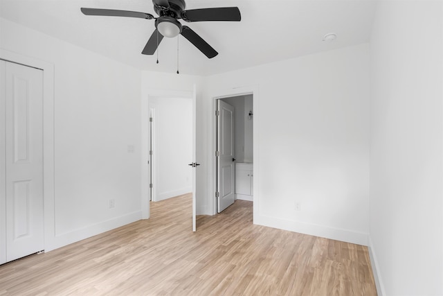 spare room featuring ceiling fan and light hardwood / wood-style flooring