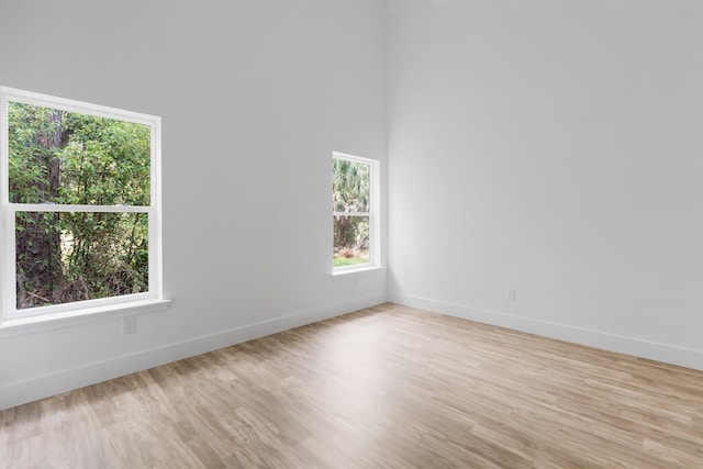 spare room with light hardwood / wood-style floors