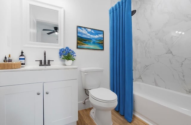 full bathroom with shower / bath combination with curtain, vanity, ceiling fan, hardwood / wood-style flooring, and toilet