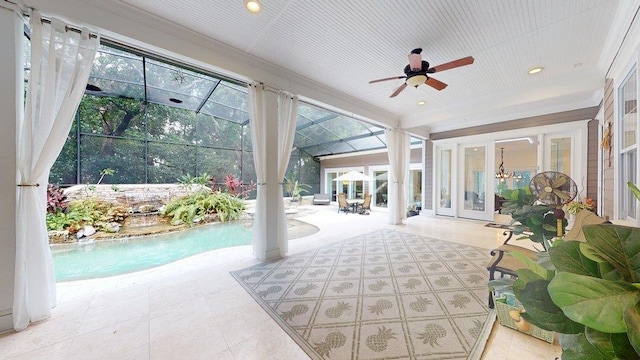 sunroom / solarium featuring ceiling fan, french doors, a healthy amount of sunlight, and a pool