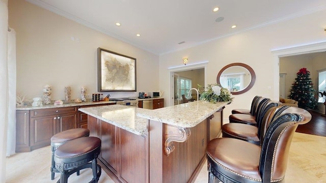 bar with light stone countertops, crown molding, stainless steel range oven, and light hardwood / wood-style flooring