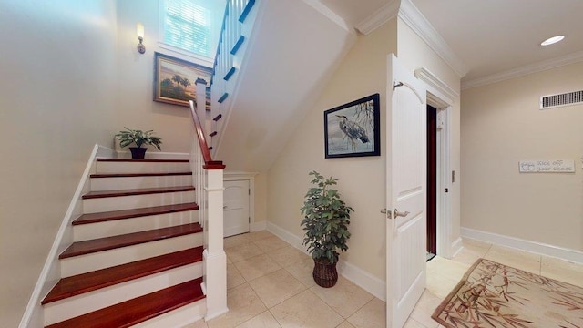 stairway featuring tile patterned flooring and crown molding