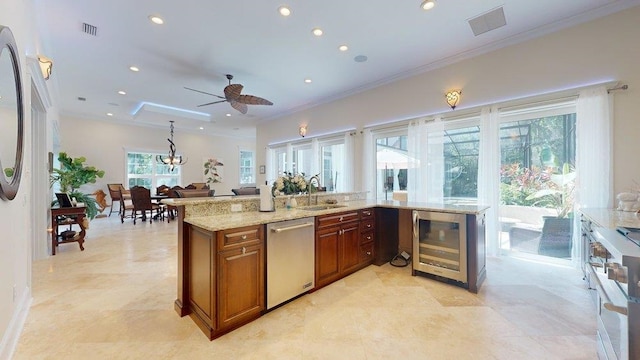 kitchen with ceiling fan, sink, beverage cooler, stainless steel dishwasher, and ornamental molding