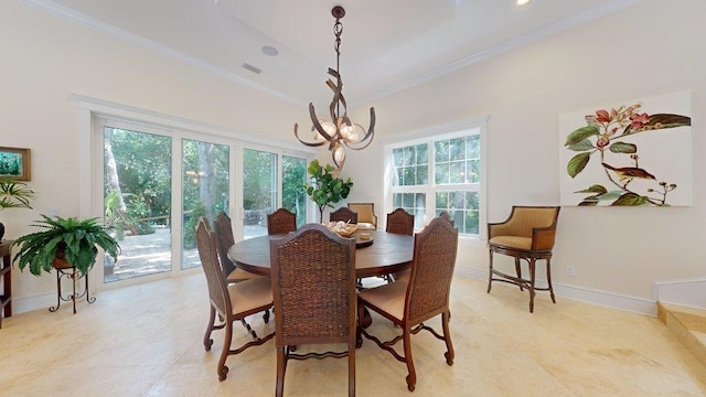 tiled dining space featuring a tray ceiling, an inviting chandelier, a wealth of natural light, and crown molding