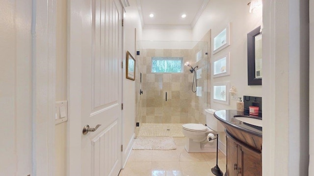 bathroom with crown molding, vanity, a shower with shower door, and toilet