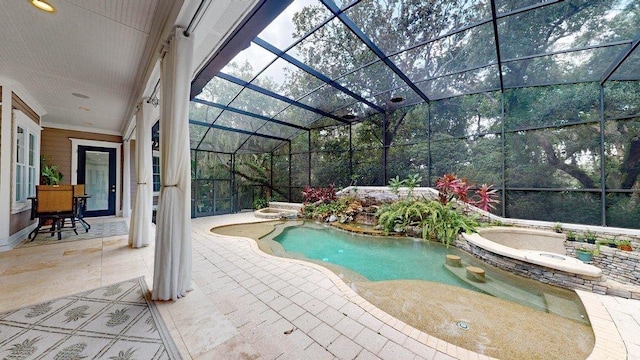 view of pool with a lanai and a patio