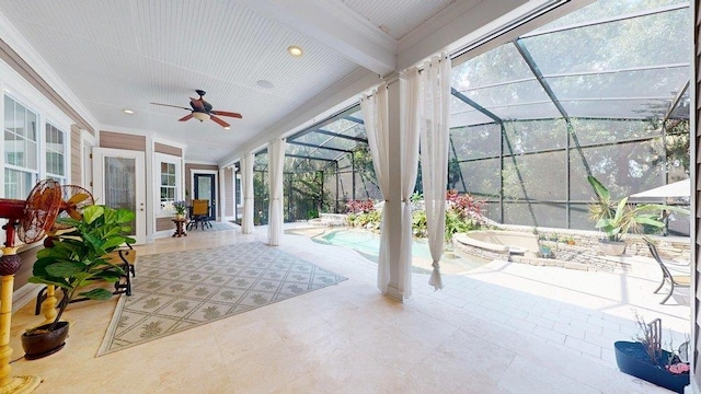 sunroom / solarium with a pool, plenty of natural light, and ceiling fan