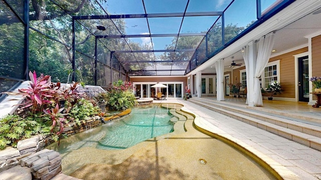 view of swimming pool with french doors, glass enclosure, and ceiling fan